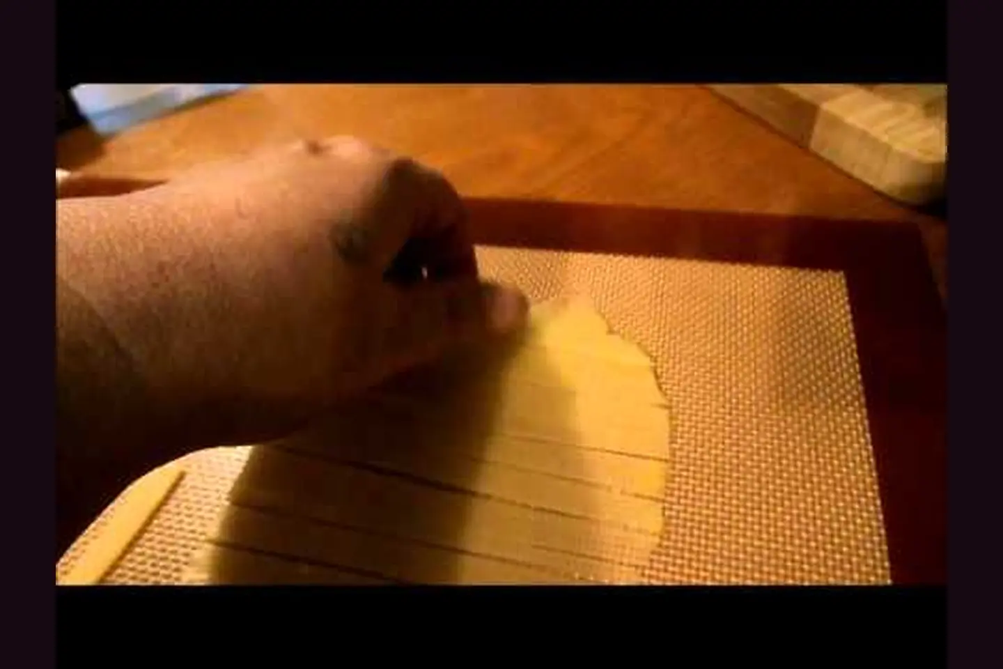 Original LCHF Diva mozzarella noodles being cut for spaghetti